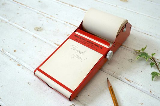 アドバタイジング・オレンジカラー・メタル製・ロール式・ヴィンテージ・メモホルダー・メモパッド USA