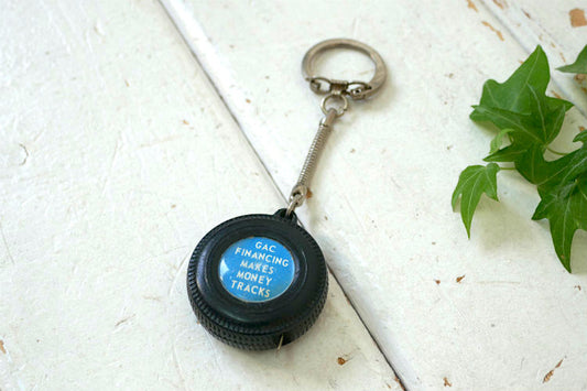 GAC FINANCING MAKES MONEY TRACKS タイヤ型 アドバタイジング ヴィンテージ メジャー 巻尺 キーホルダー USA