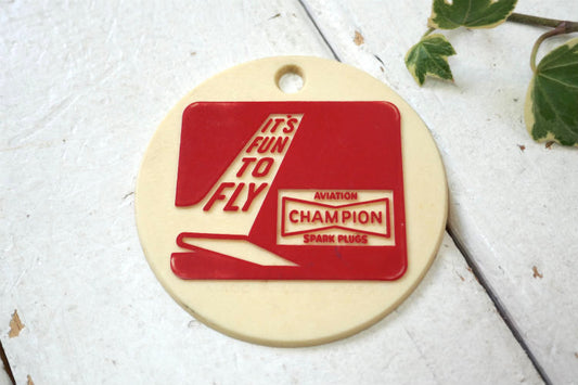 IT'S FUN TO FLY チャンピオンCHAMPION プラグ USA 1970y アドバタイジング 飛行機 ヴィンテージ キーホルダー